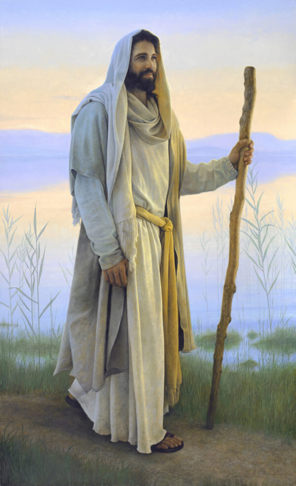 smiling jesus walking with a staff