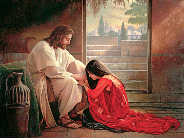 woman in red dress kneeling at jesus feet